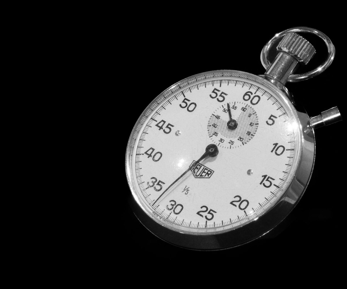 Vintage mechanical stopwatch on a black background