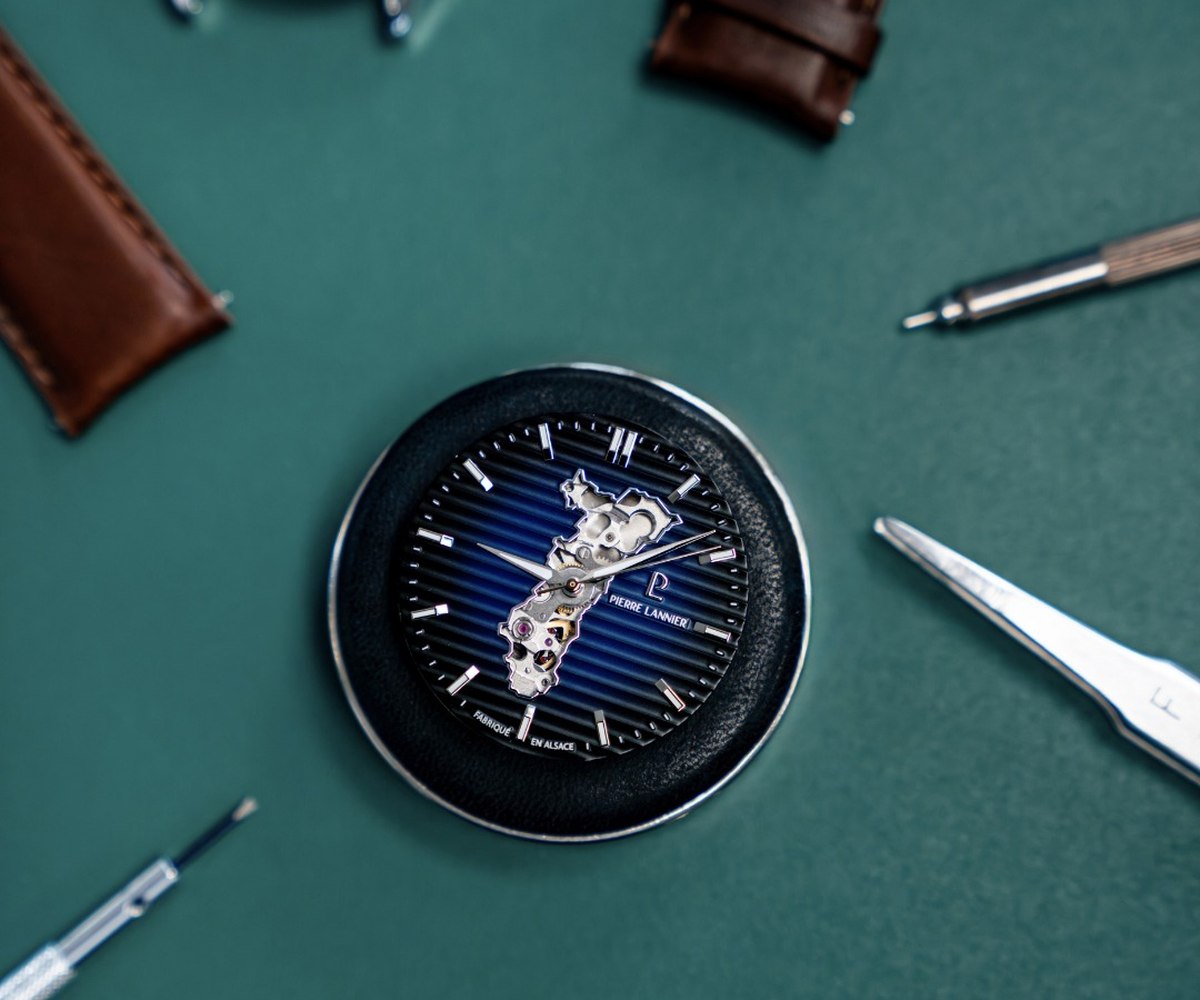 Watchmaker's workbench, tools, and movement