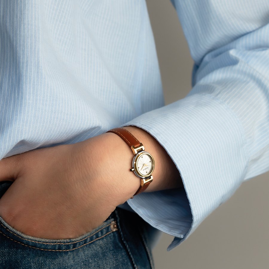 Michel Herbelin, montre doree au poignet