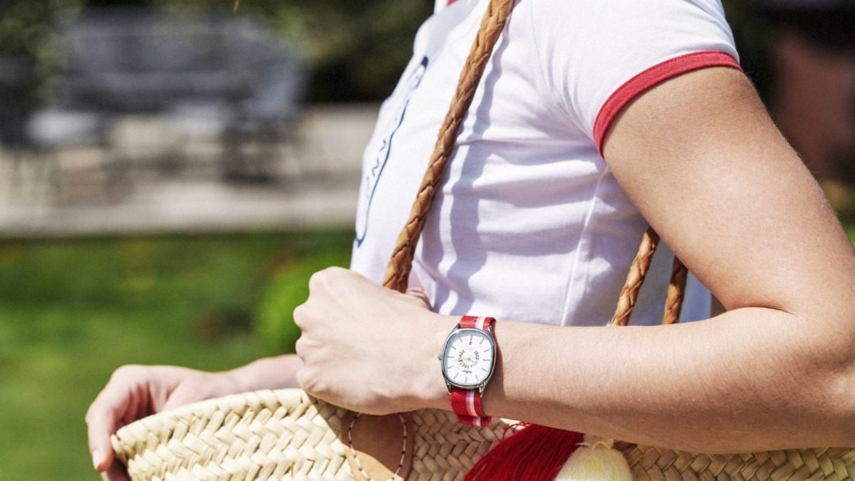 Women's watch with a red-and-white striped NATO strap, featuring colors that match the summer basket