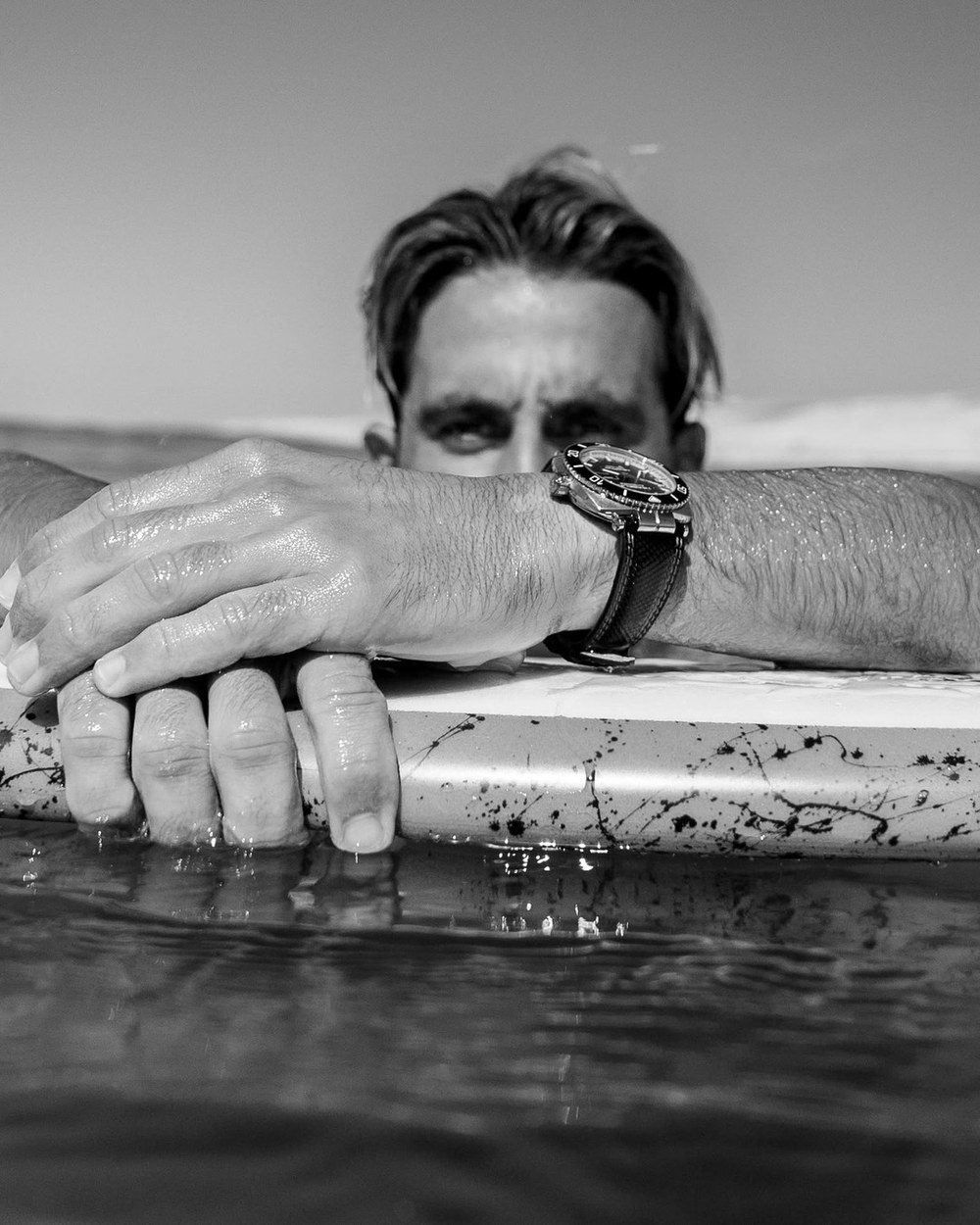 Diving watch worn on the wrist, black-and-white photograph